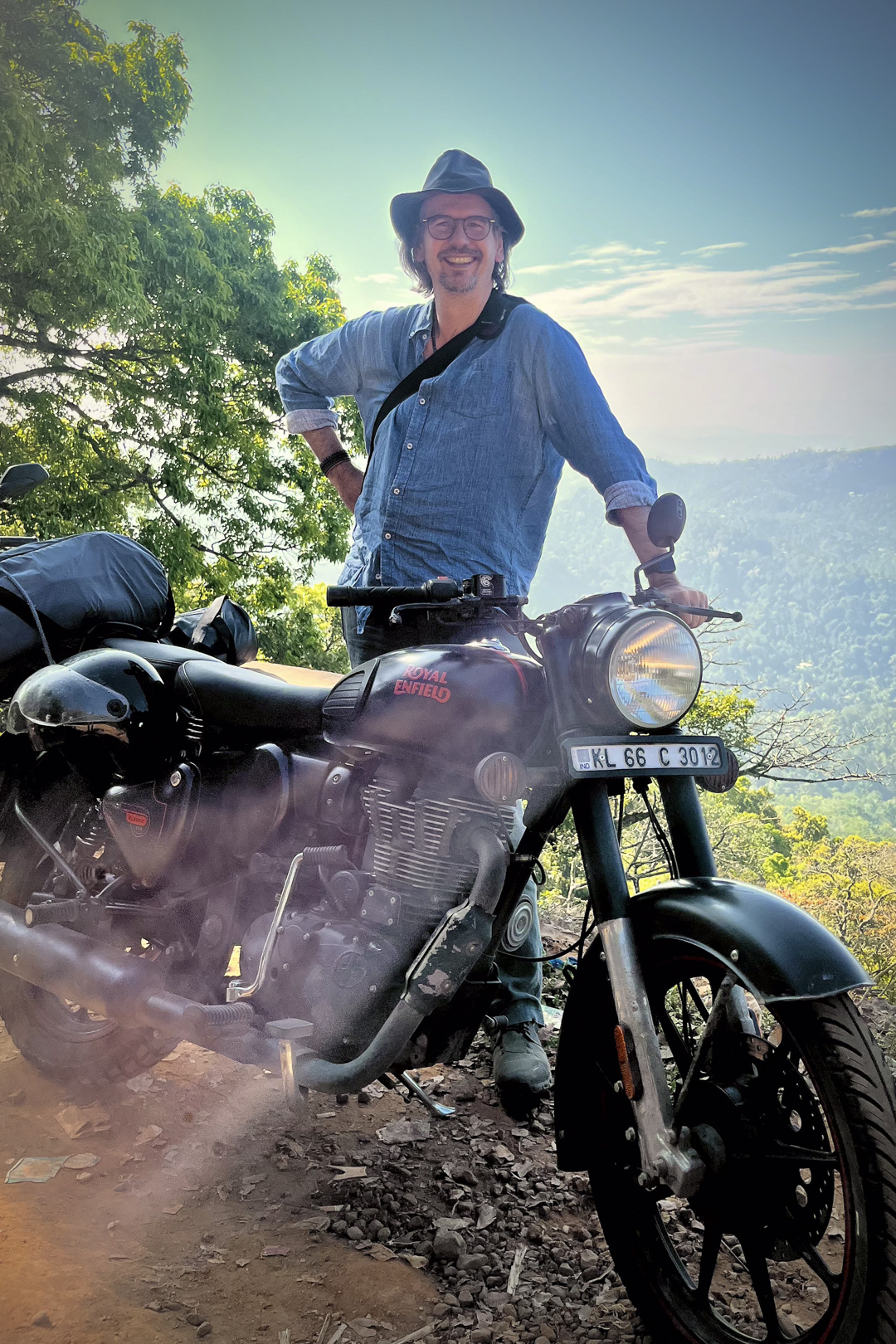 Thorsten Mehret beside a motorcycle during a journey through India